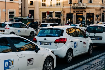 A white car in the street during the day
